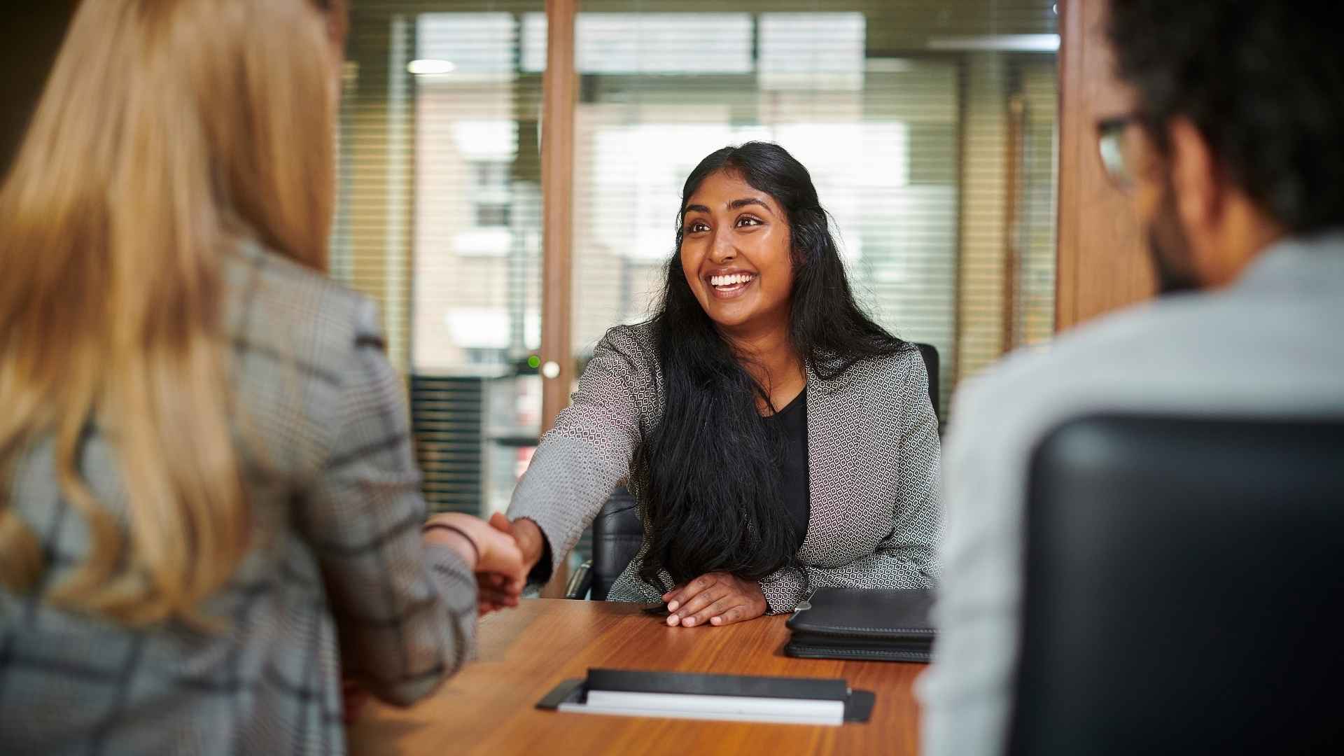 A young professional in a meeting with colleagues