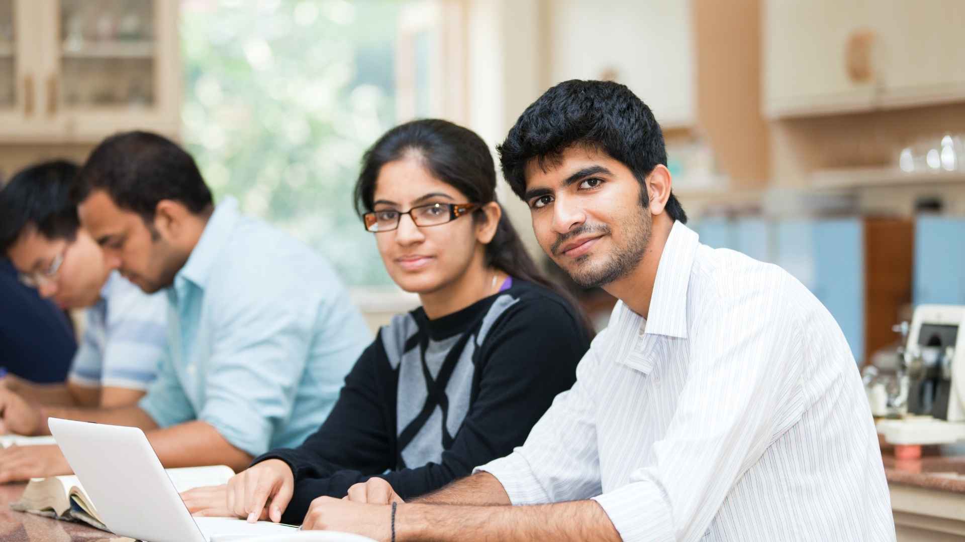 College students sitting together in a classroom